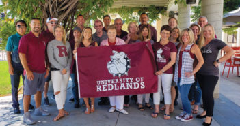 Alumni Board President Normajean Hinders ’65 (holding the banner on the right) and fellow board members show their Bulldog pride.