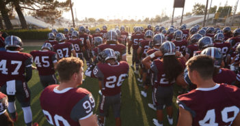 The Bulldogs prepare for their first home game of the season. They go on to beat the George Fox Bruins, 20 to 12. (Photo by William Vasta)
