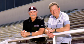 President Ralph Kuncl (right) stands in Ted Runner Stadium with his friend and colleague Coach Mike Maynard. (Photo by Carlos Puma)